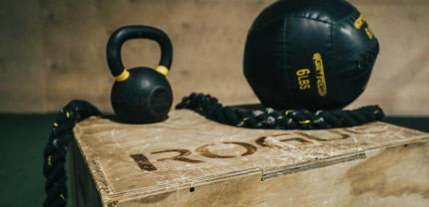 black metal kettle bell and heavy bag