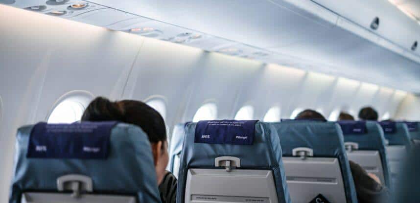 people sitting on gray and white airplane seats