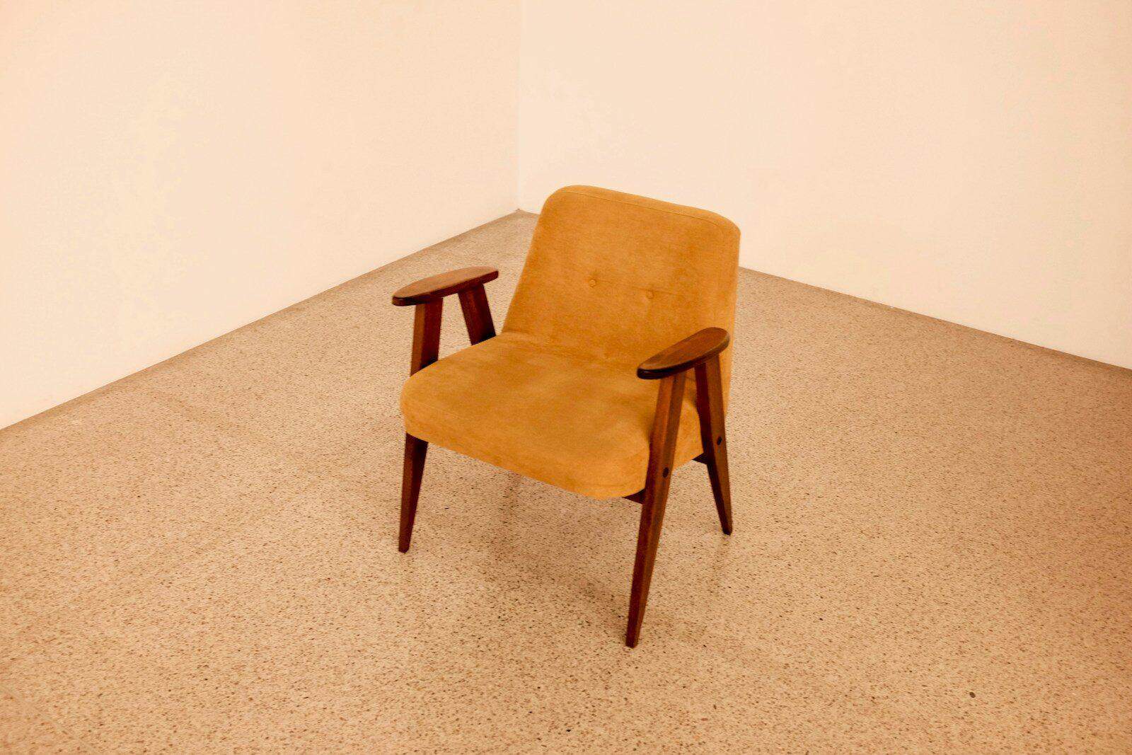 brown wooden framed beige padded chair